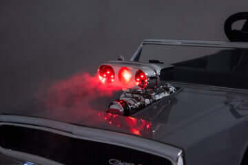 Dodge Charger kids ride on car 24v with red lights and smoke effects on engine.
