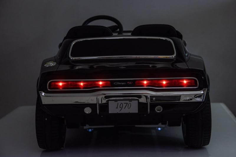 Dodge Charger kids ride on car 24v featuring detailed rear view with LED lights and sleek design.