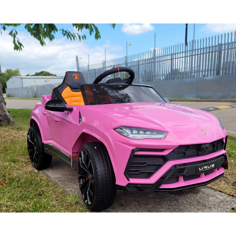 Kids Electric Lamborghini Urus Ride On car in pink color, featuring sporty design and luxurious details for children.